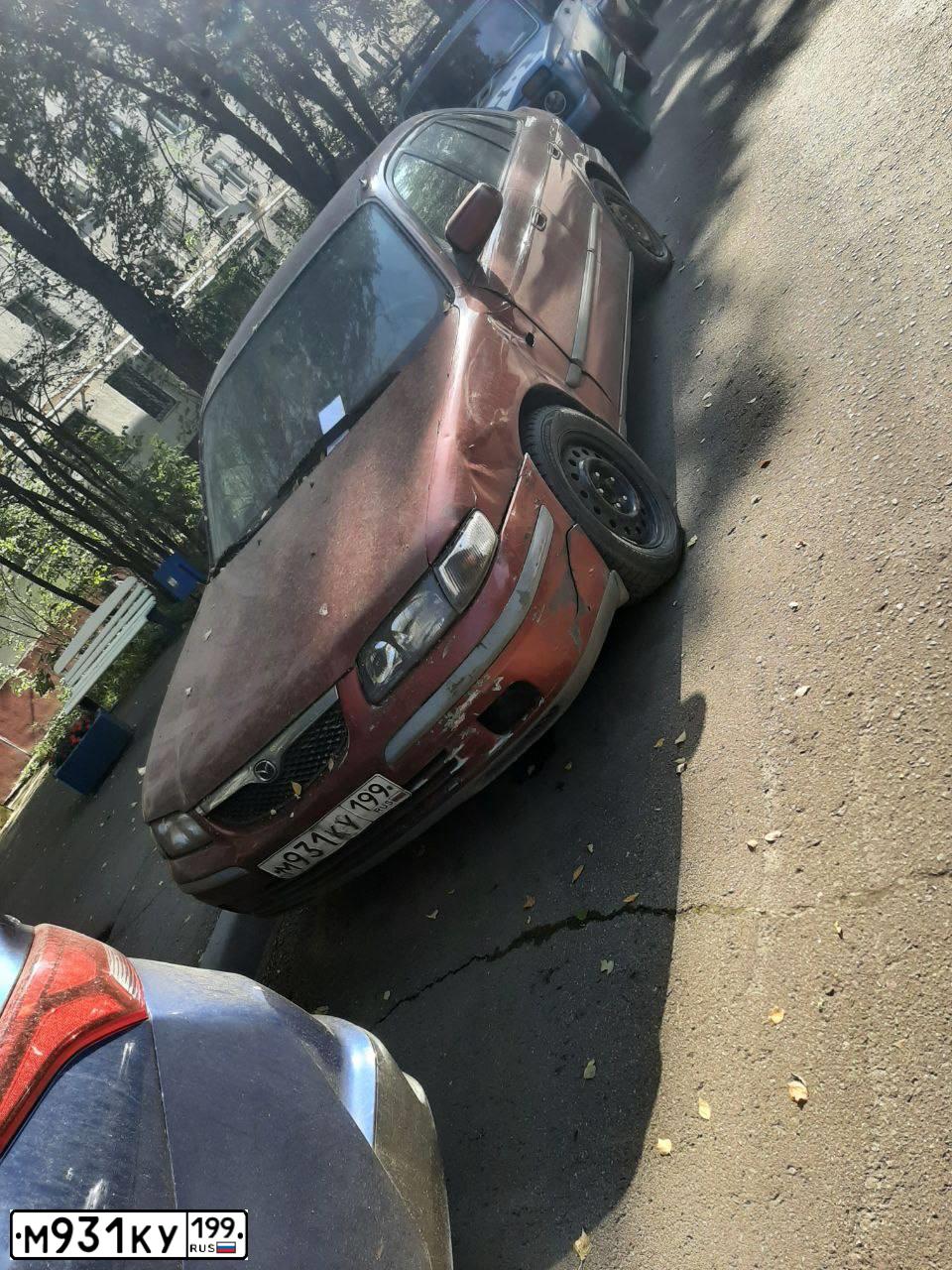 Фото автомобиля MAZDA 626, 1997 — госномер М931КУ199. Цвет: ВИШНЕВЫЙ