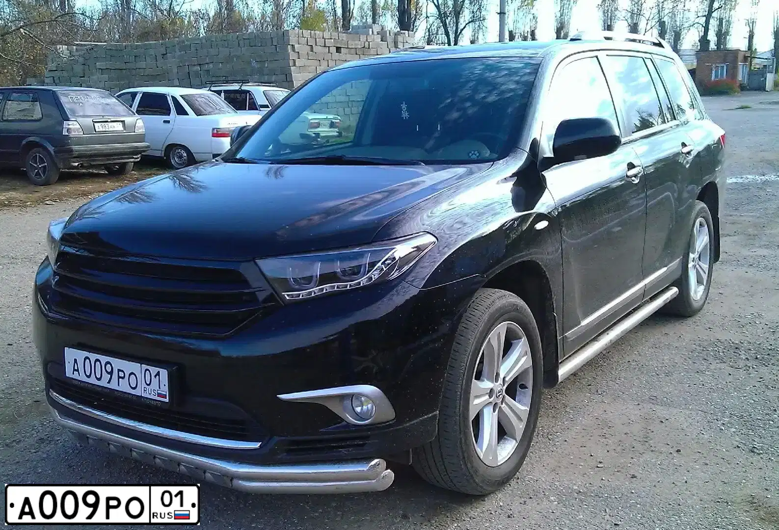 Фото автомобиля TOYOTA HIGHLANDER, 2012 — госномер А009РО01. Цвет: ЧЕРНЫЙ