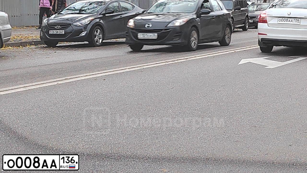 Фото автомобиля FORD FOCUS, 2012 — госномер О008АА136. Цвет: СЕРО-ГОЛУБОЙ