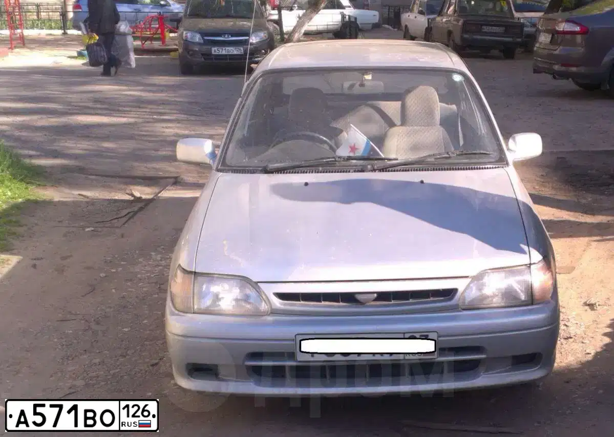 Фото автомобиля LADA 2190 GRANTA, 2014 — госномер Е295РА08. Цвет: Золотисто-коричневый