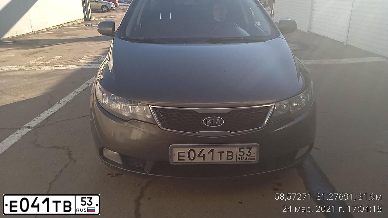 Фото автомобиля KIA CERATO, 2011 — госномер Е041ТВ53. Цвет: бронзовый