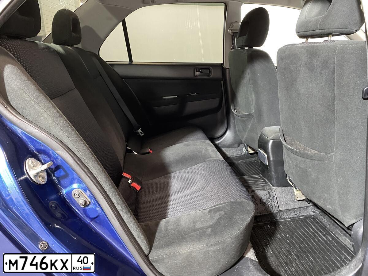 Фото автомобиля MITSUBISHI LANCER, 2005 — госномер О909ВА716. Цвет: синий