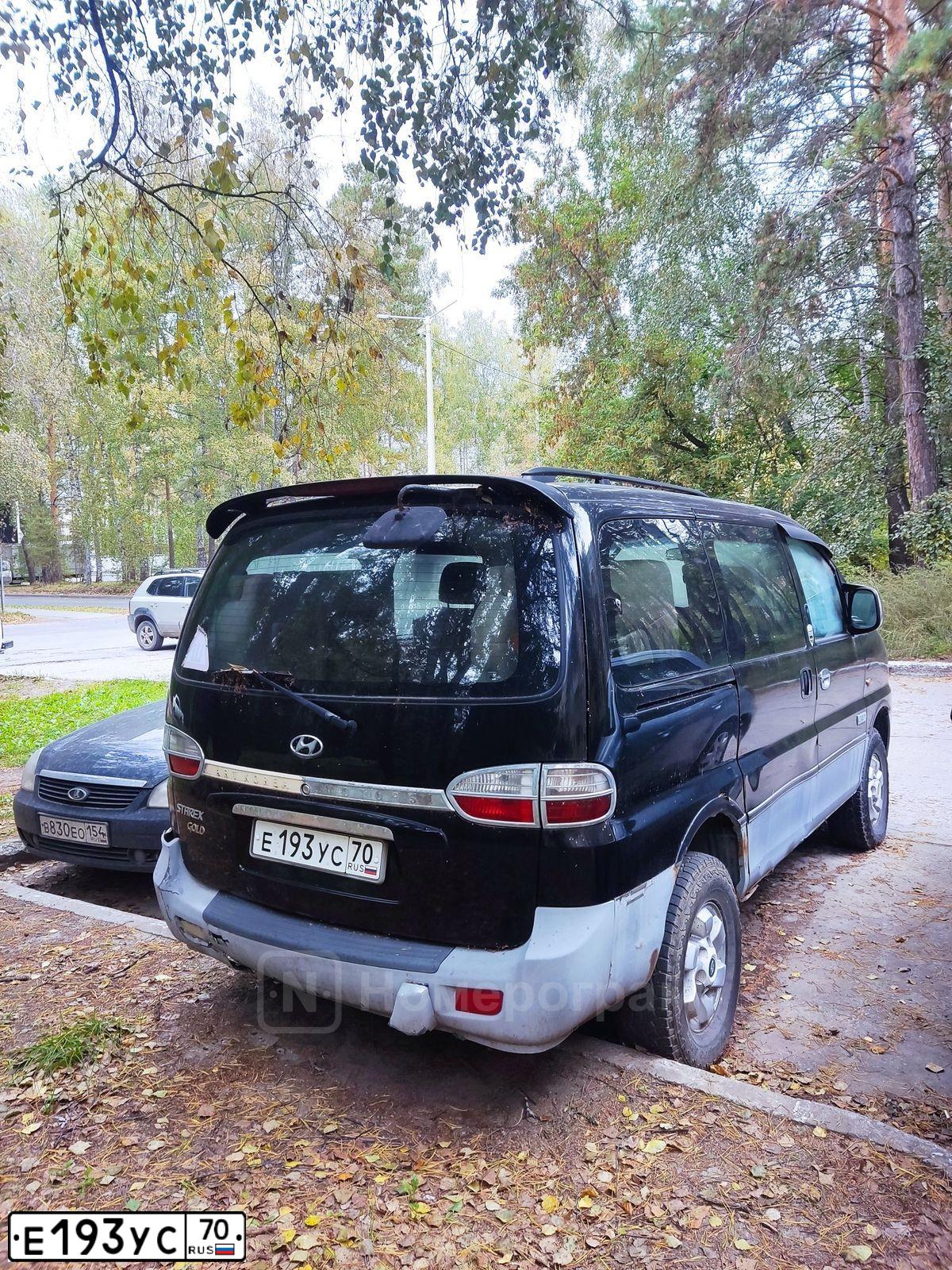 Фото автомобиля HYUNDAI H 1/H 100/STAREX, 2006 — госномер Е193УС70. Цвет: ЧЕРНО-СЕРЫЙ