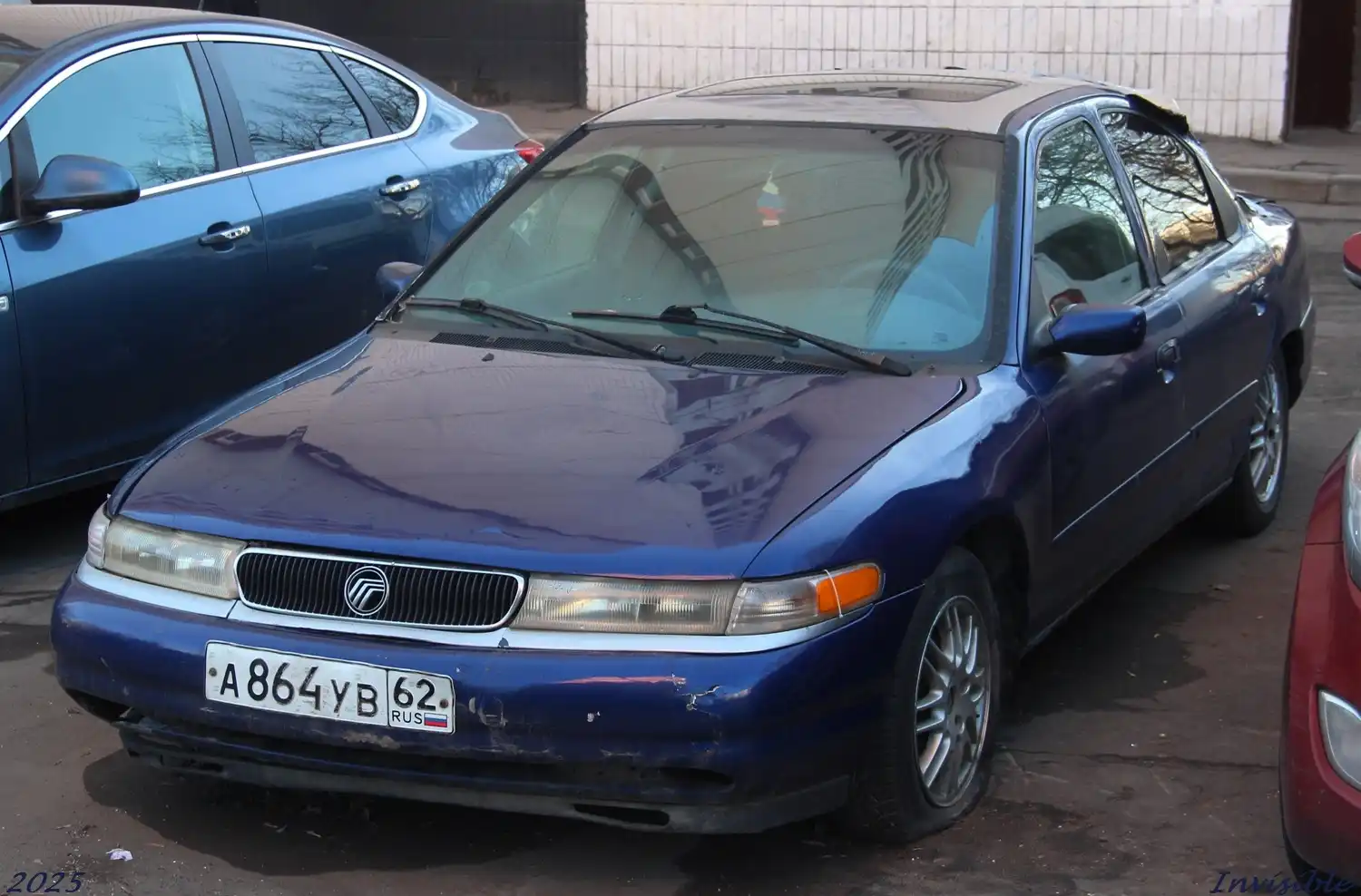 Фото автомобиля MERCURY MYSTIQUE, 1995 — госномер А864УВ62. Цвет: синий