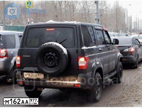 Фото автомобиля UAZ 3163 PATRIOT, 2019 — госномер Т653СО799. Цвет: ЧЕРНЫЙ МЕТАЛЛИК