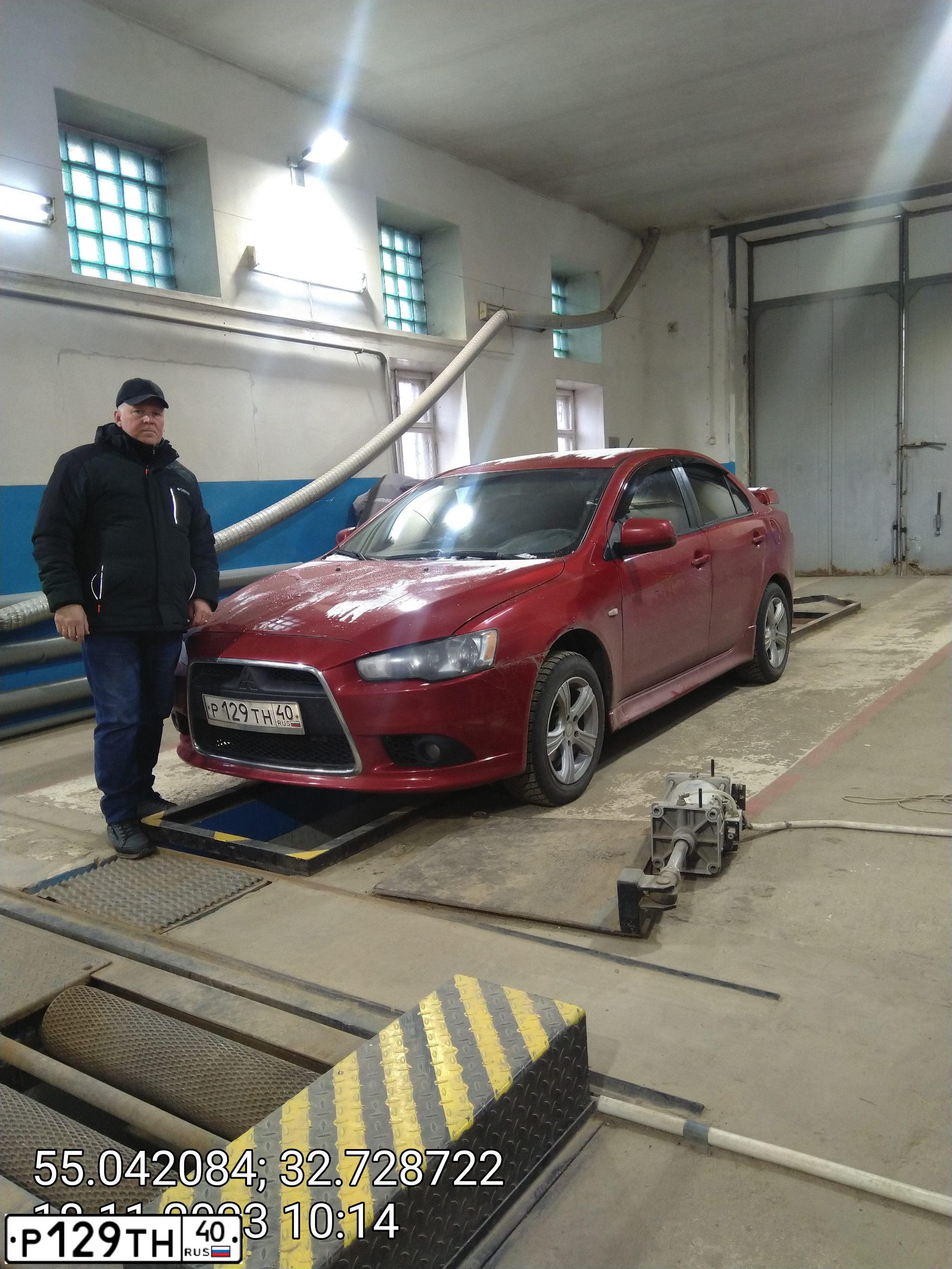 Фото автомобиля MITSUBISHI LANCER, 2011 — госномер Р129ТН40. Цвет: КРАСНЫЙ