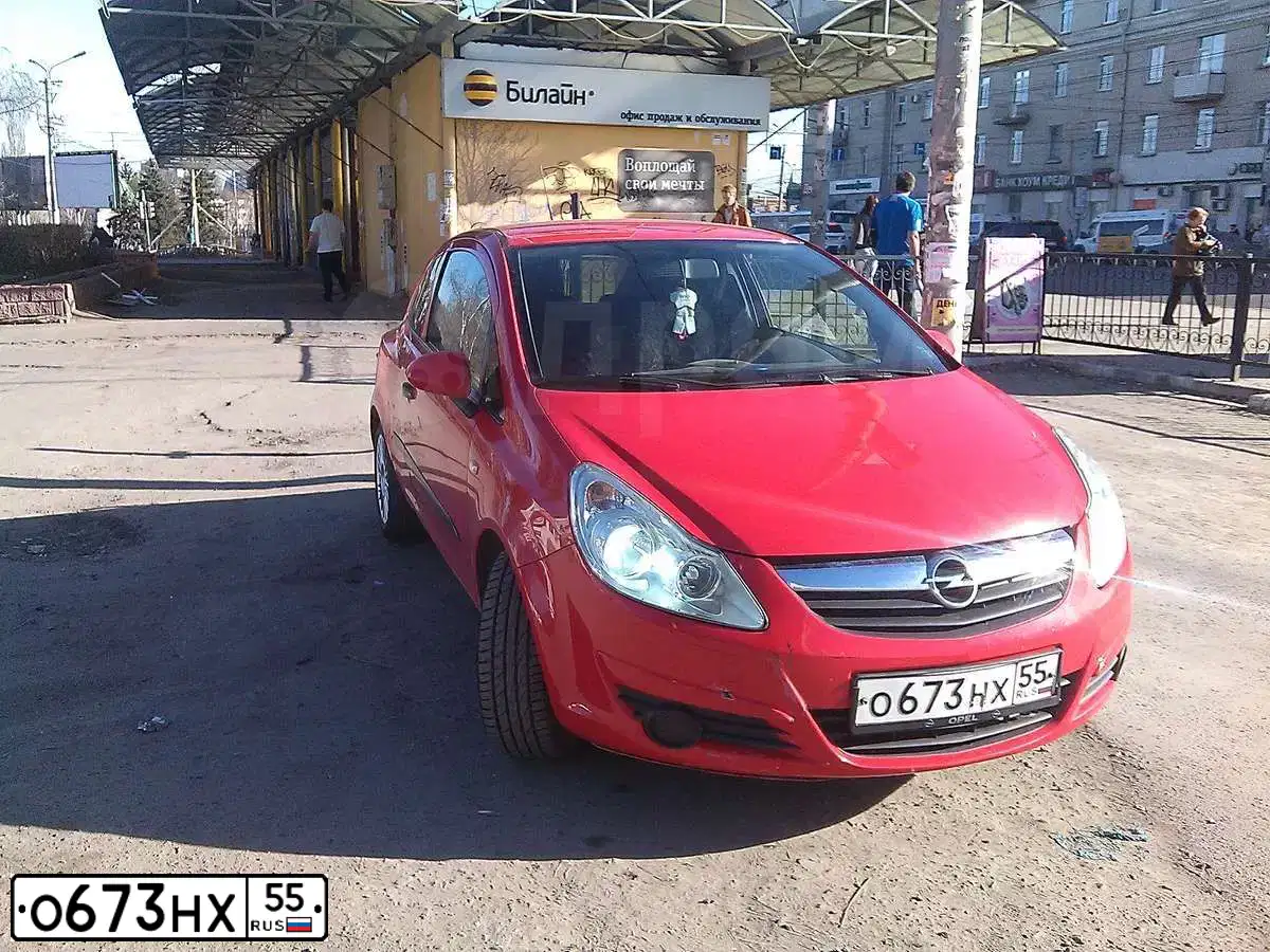 Фото автомобиля OPEL CORSA, 2007 — госномер О673НХ55. Цвет: Красный
