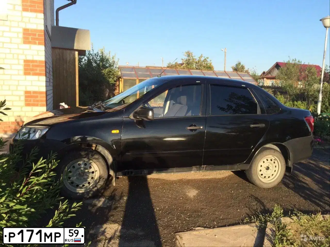 Фото автомобиля LADA 219060 LADA GRANTA, 2013 — госномер Т062АК774. Цвет: ЧЕРНЫЙ