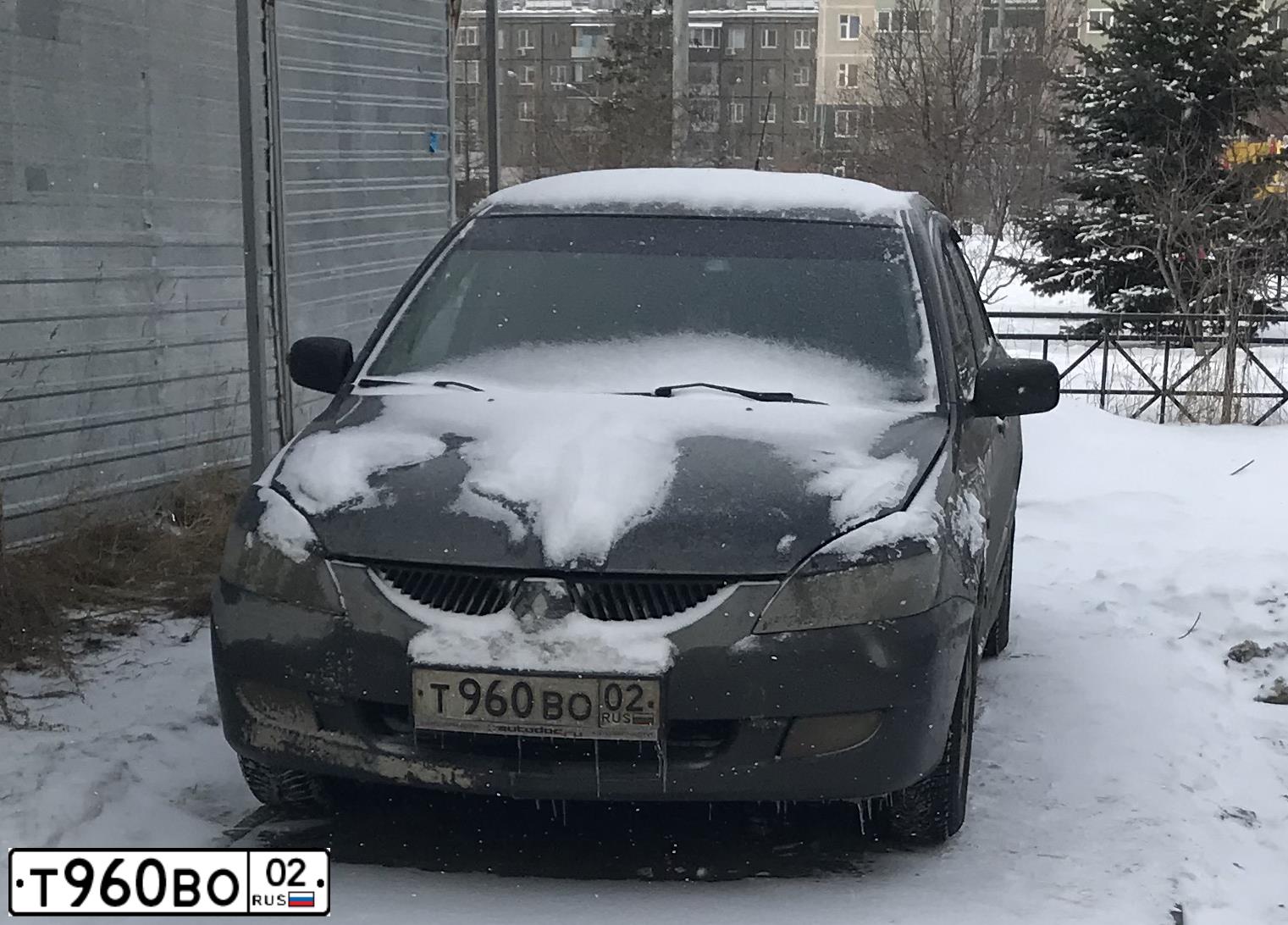 Фото автомобиля MITSUBISHI LANCER, 2003 — госномер О978АМ702. Цвет: СЕРЫЙ