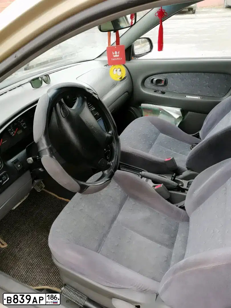 Фото автомобиля KIA SPECTRA, 2007 — госномер Е189УХ186. Цвет: ЗОЛОТИСТО-БЕЖЕВЫЙ