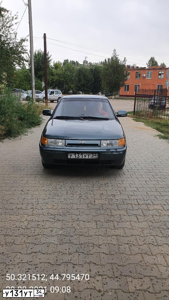 Фото автомобиля LADA 2110 LADA, 2006 — госномер К345ОО30. Цвет: СЕРО-СИНЕ-ЗЕЛЕНЫЙ