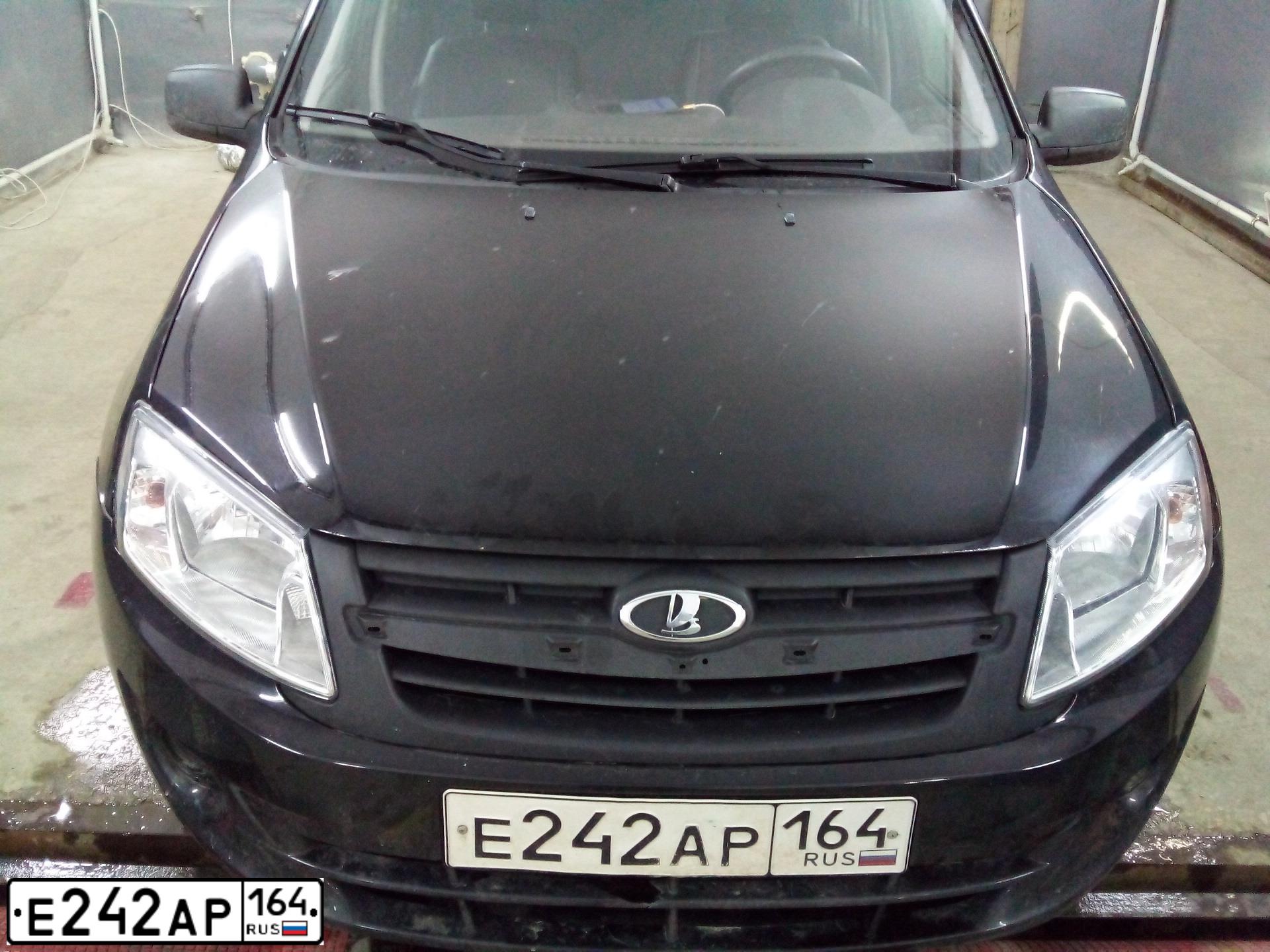 Фото автомобиля LADA 2190 GRANTA, 2014 — госномер Х155ТМ161. Цвет: ЧЕРНЫЙ