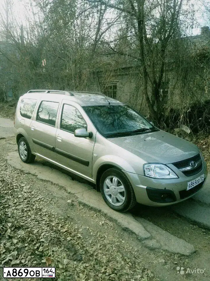 Фото автомобиля LADA LARGUS, 2016 — госномер А869ОВ164. Цвет: СЕРО-БЕЖЕВЫЙ