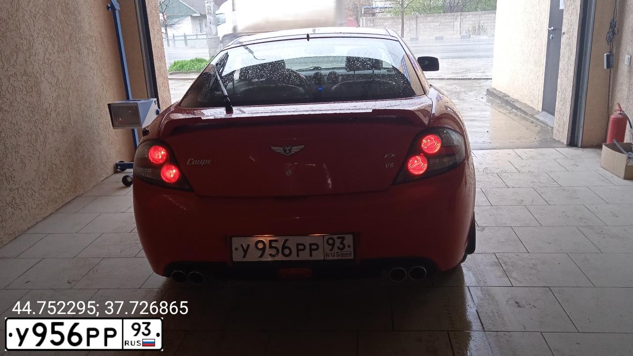 Фото автомобиля HYUNDAI /S-/COUPE / TUSCANI, 2007 — госномер О376ЕН126. Цвет: Красный