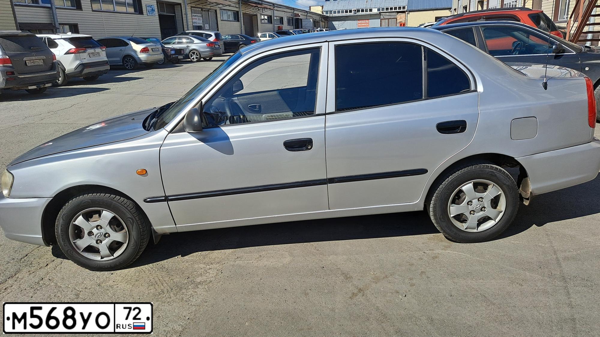Фото автомобиля TAGAZ Z ACCENT, 2005 — госномер М215ЕА186. Цвет: СЕРЕБРИСТЫЙ