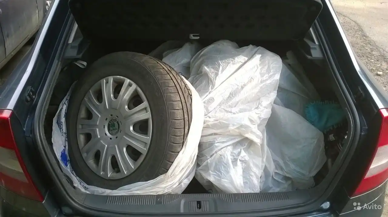 Фото автомобиля SKODA OCTAVIA, 2010 — госномер Т219ТТ99. Цвет: СЕРЫЙ ТЕМНЫЙ