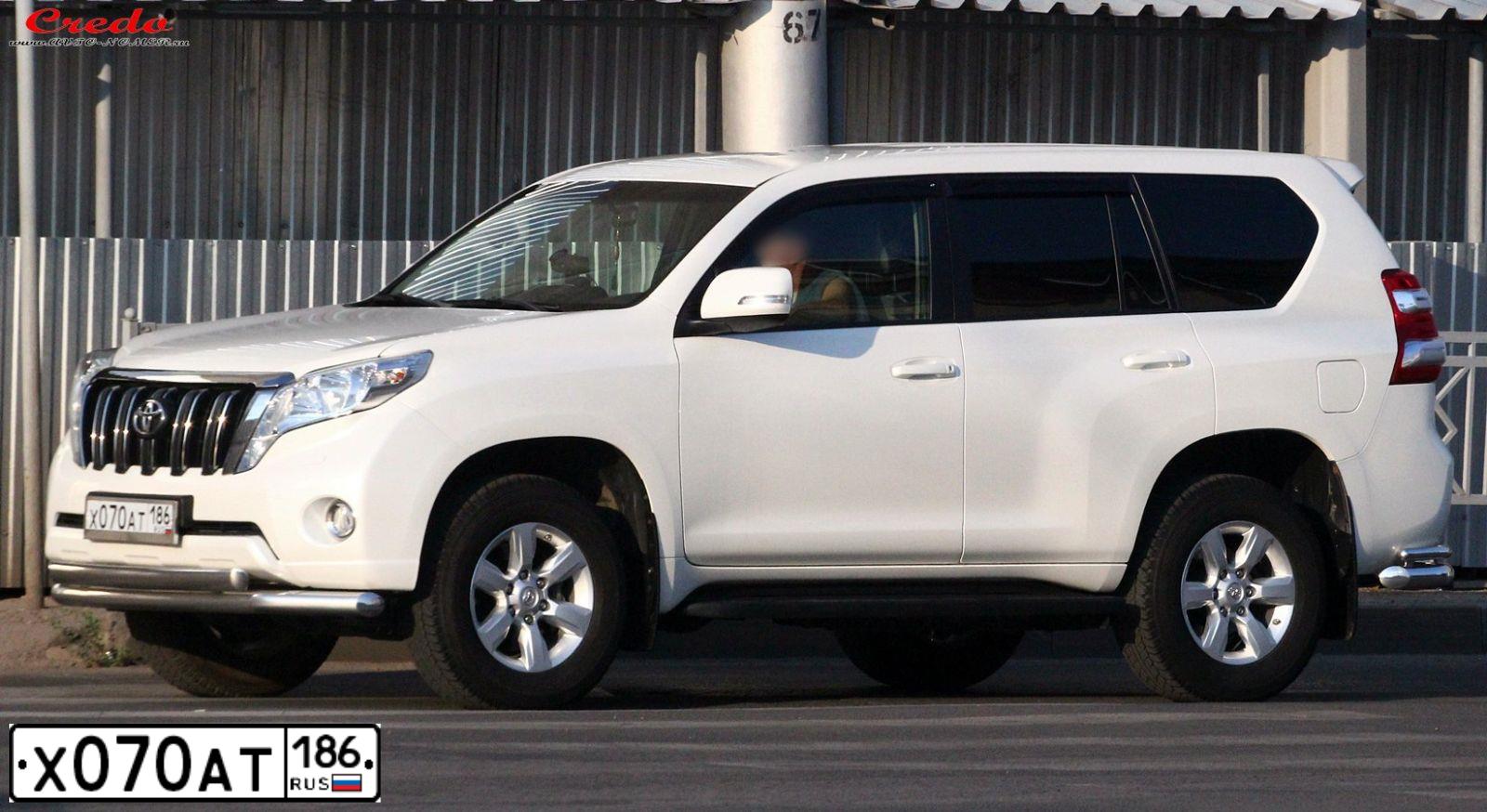 Фото автомобиля TOYOTA LANDCRUISER, 2014 — госномер Х070АТ186. Цвет: БЕЛЫЙ ПЕРЛАМУТР