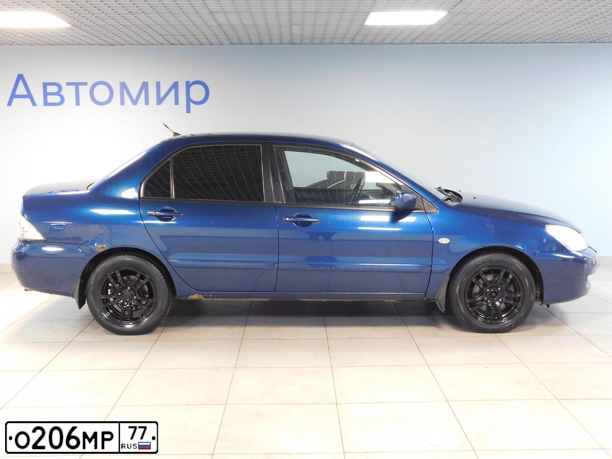 Фото автомобиля VOLVO V40, 2013 — госномер М326УС69. Цвет: Белый