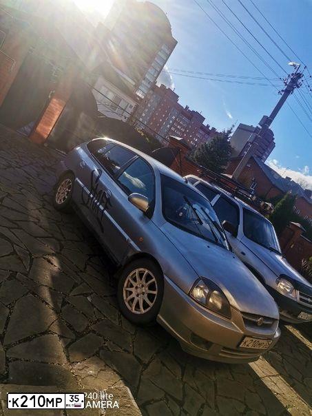 Фото автомобиля KIA RIO, 2003 — госномер К210МР35. Цвет: СЕРЕБРИСТЫЙ