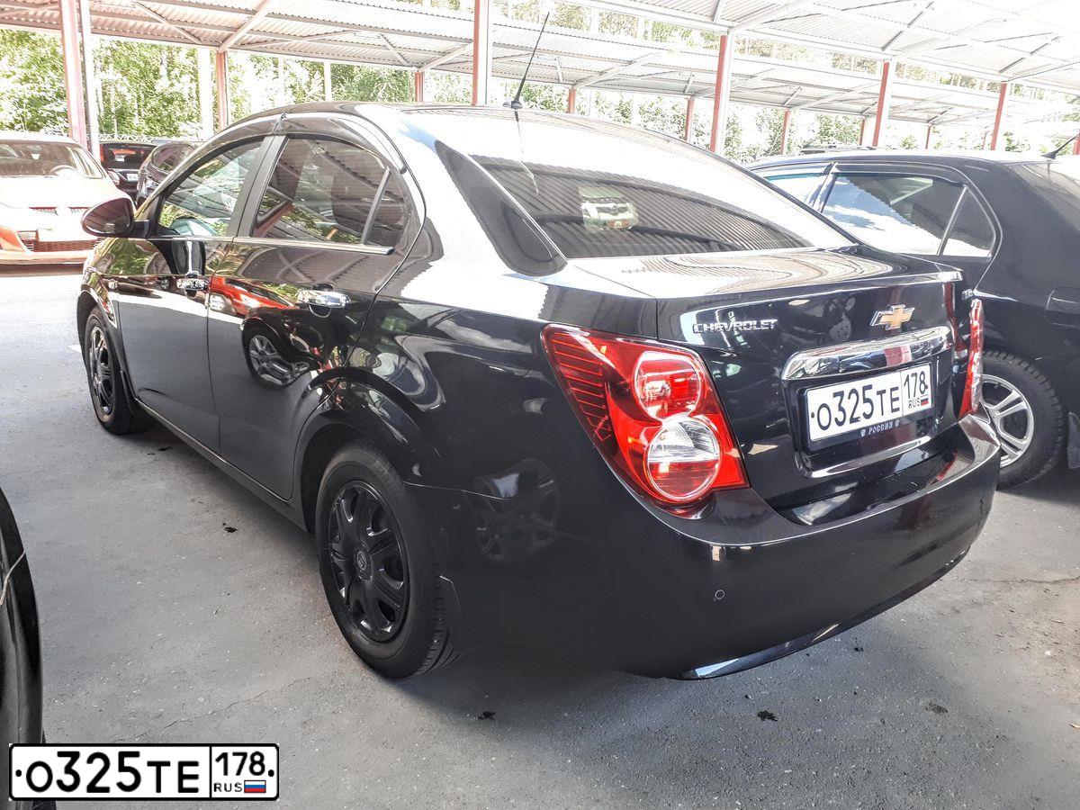 Фото автомобиля CHEVROLET AVEO, 2012 — госномер К750ХР186. Цвет: ЧЕРНЫЙ