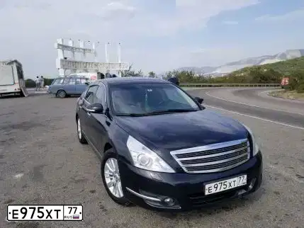 Фото автомобиля NISSAN TEANA, 2008 — госномер Е975ХТ77. Цвет: ЧЕРНЫЙ