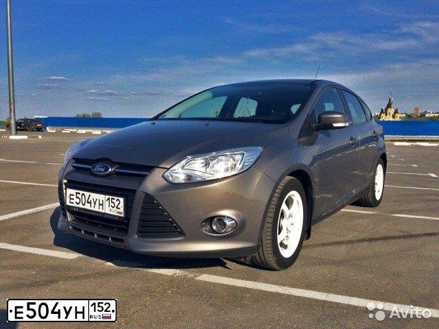 Фото автомобиля FORD FOCUS, 2011 — госномер Е504УН152. Цвет: СЕРО-КОРИЧНЕВЫЙ
