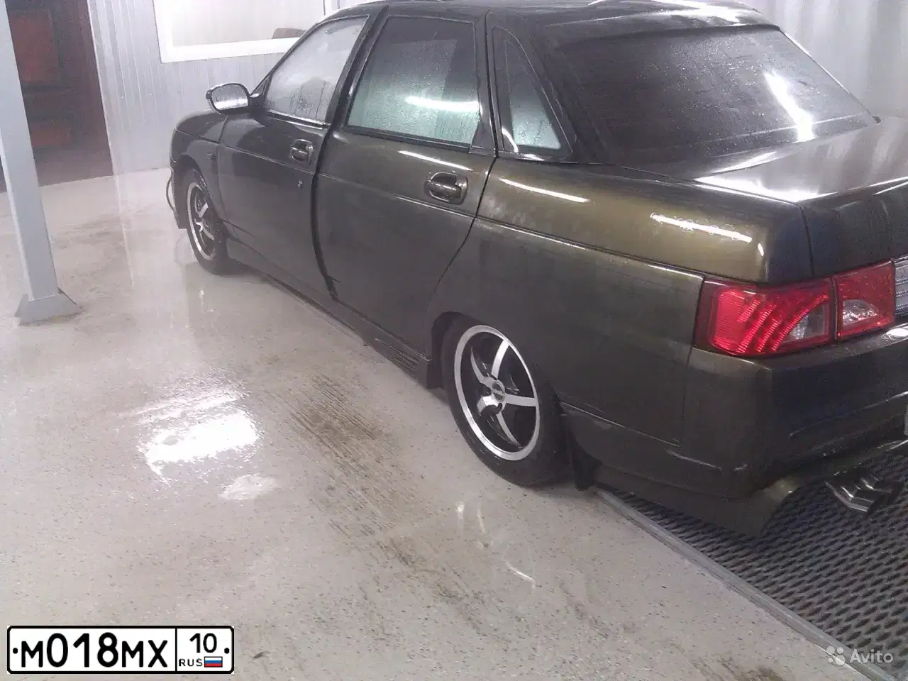 Фото автомобиля LADA 2110, 2005 — госномер М018МХ10. Цвет: ЗОЛОТИСТО ТЕМНО ЗЕЛЕНЫЙ
