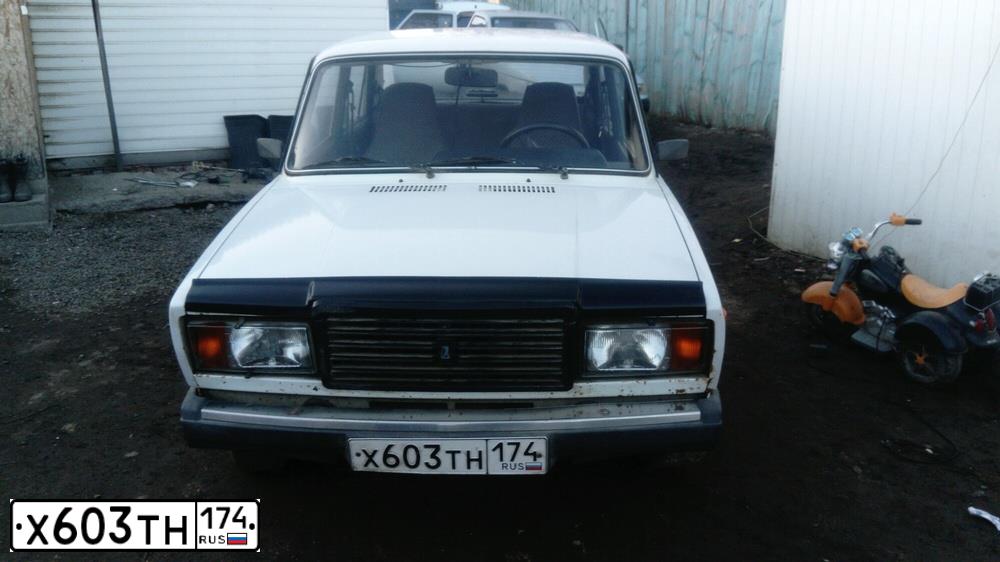 Фото автомобиля LADA 2107, 2009 — госномер А094ММ174. Цвет: ЯРКО-БЕЛЫЙ