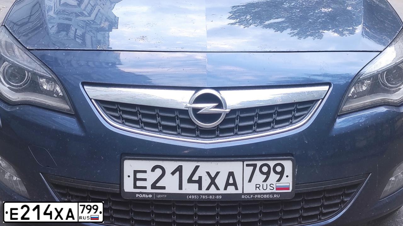 Фото автомобиля OPEL ASTRA, 2011 — госномер Е214ХА799. Цвет: синий
