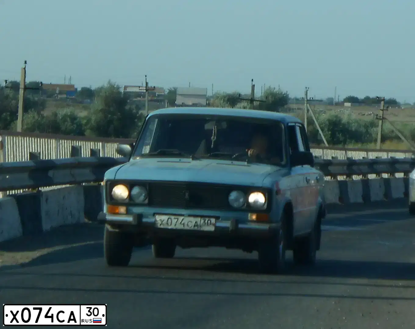 Фото автомобиля LADA 2106, 1994 — госномер Х074СА30. Цвет: СЕРО-ГОЛУБОЙ