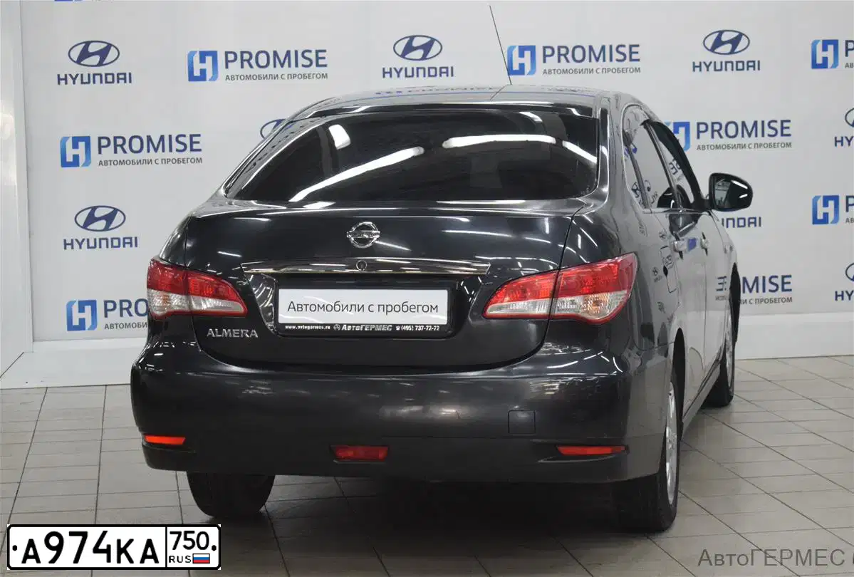 Фото автомобиля NISSAN ALMERA /AVTOVAZ/, 2014 — госномер Н219РМ32. Цвет: ЧЕРНЫЙ