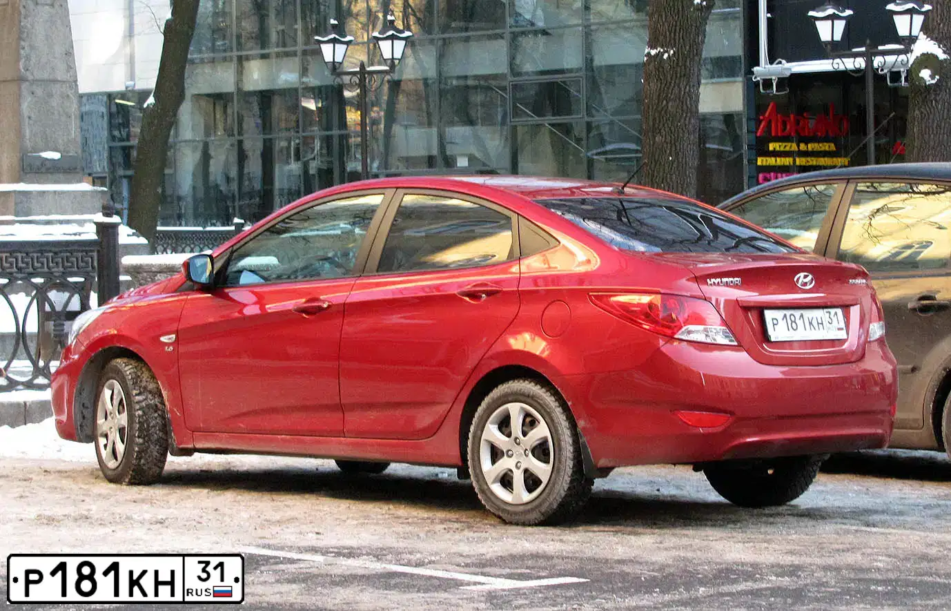 Фото автомобиля HYUNDAI SOLARIS, 2011 — госномер Т291МН31. Цвет: КРАСНЫЙ ГРАНАТ