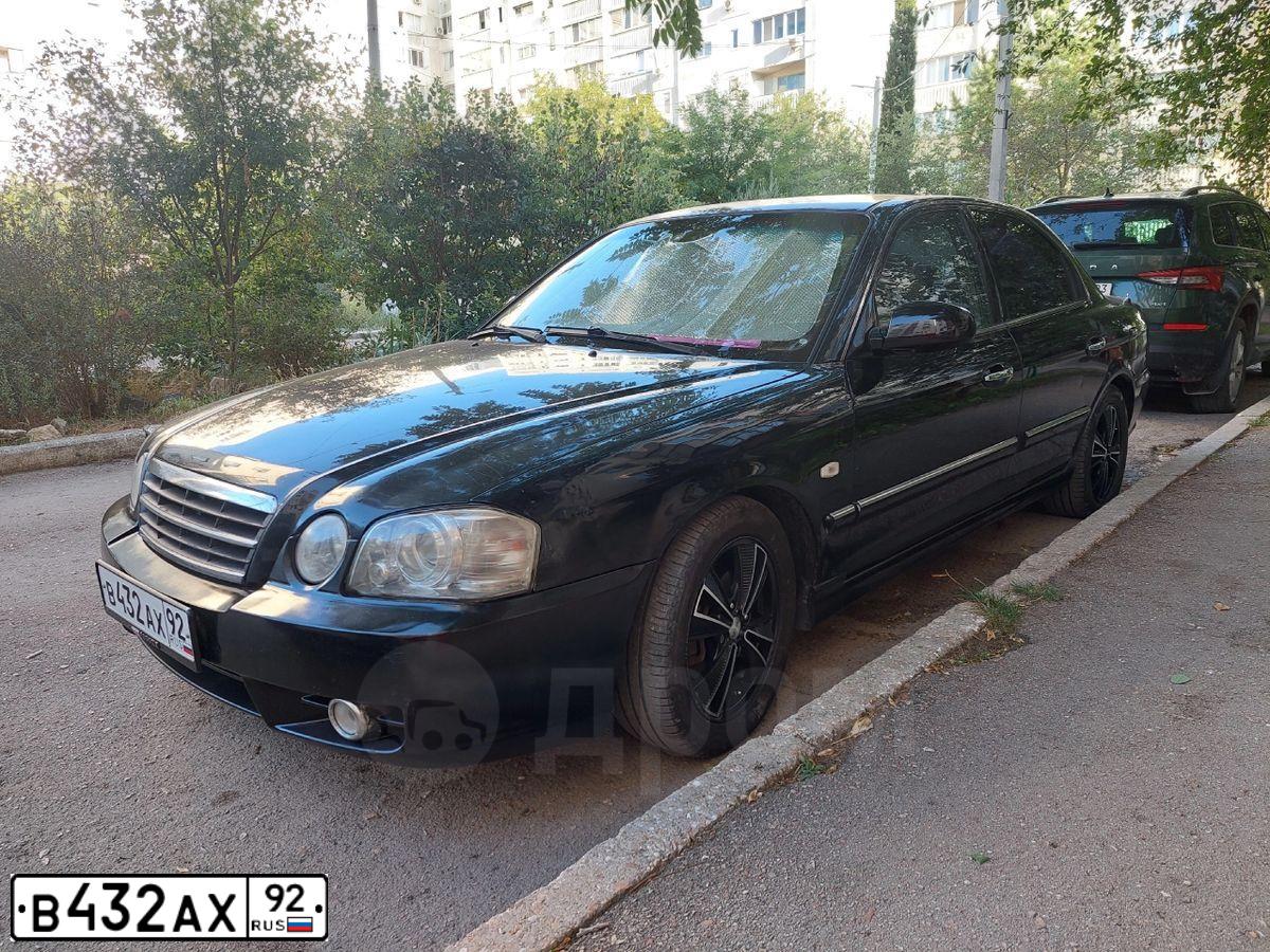 Фото автомобиля KIA MAGENTIS / OPTIMA, 2005 — госномер М815АЕ185. Цвет: ЧЕРНЫЙ