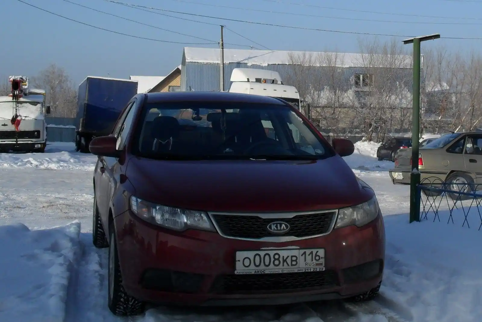 Фото автомобиля KIA CERATO, 2011 — госномер К900ВУ21. Цвет: Красный
