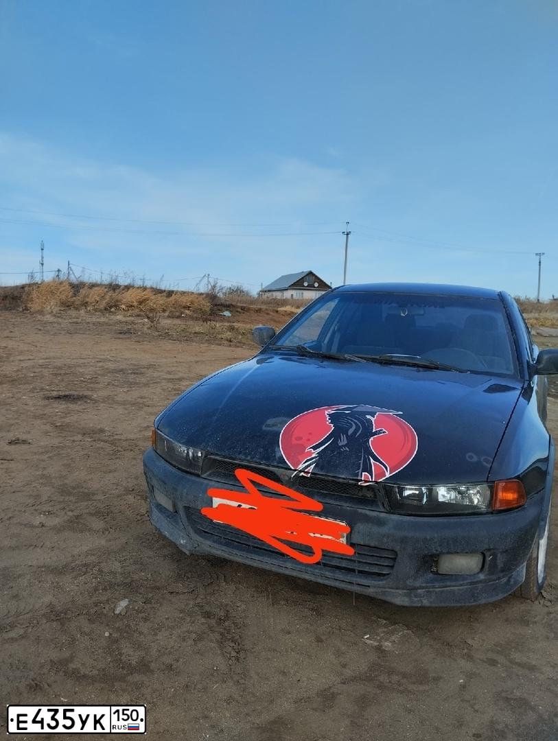 Фото автомобиля MITSUBISHI GALANT, 1997 — госномер Е690УХ178. Цвет: Темно-зеленый