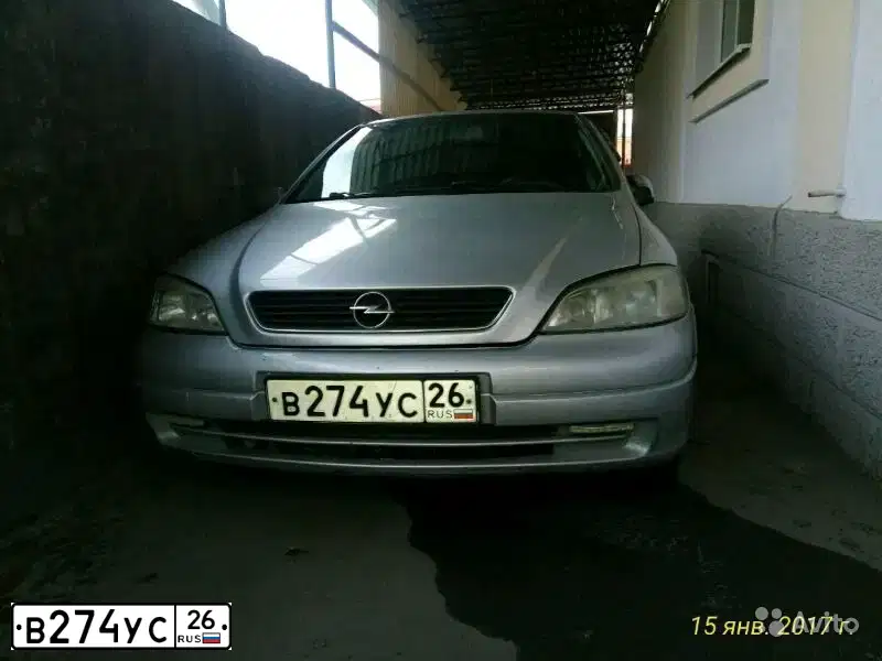 Фото автомобиля OPEL ASTRA, 2001 — госномер Т906РТ97. Цвет: Серый