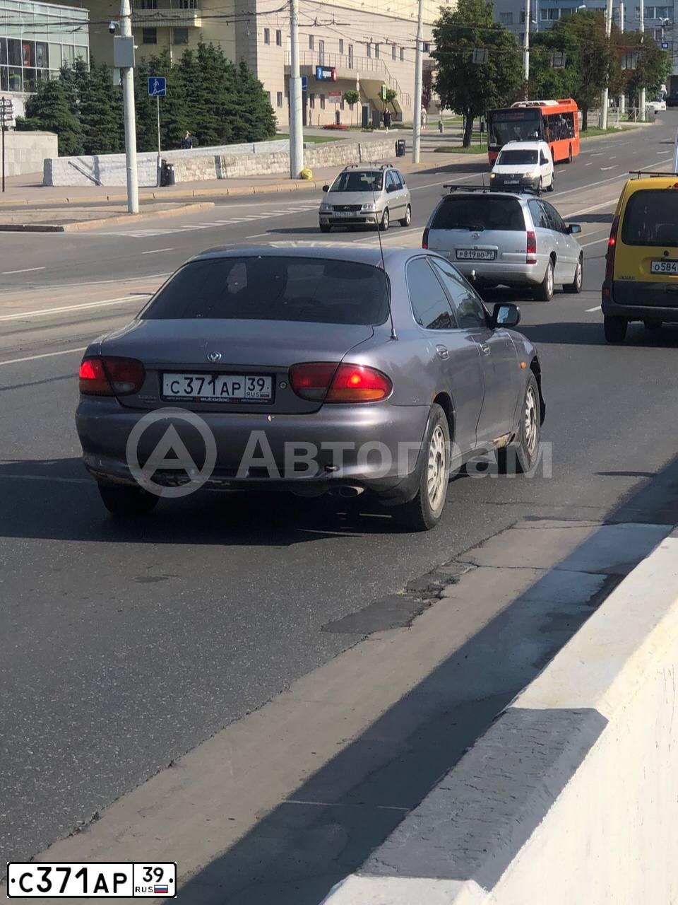 Фото автомобиля MAZDA XEDOS 6 / XEDOS 9, 1994 — госномер С371АР39. Цвет: СЕРЫЙ