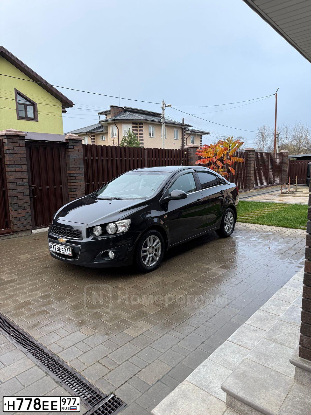 Фото автомобиля CHEVROLET AVEO, 2012 — госномер Н778ЕЕ977. Цвет: ЧЕРНЫЙ