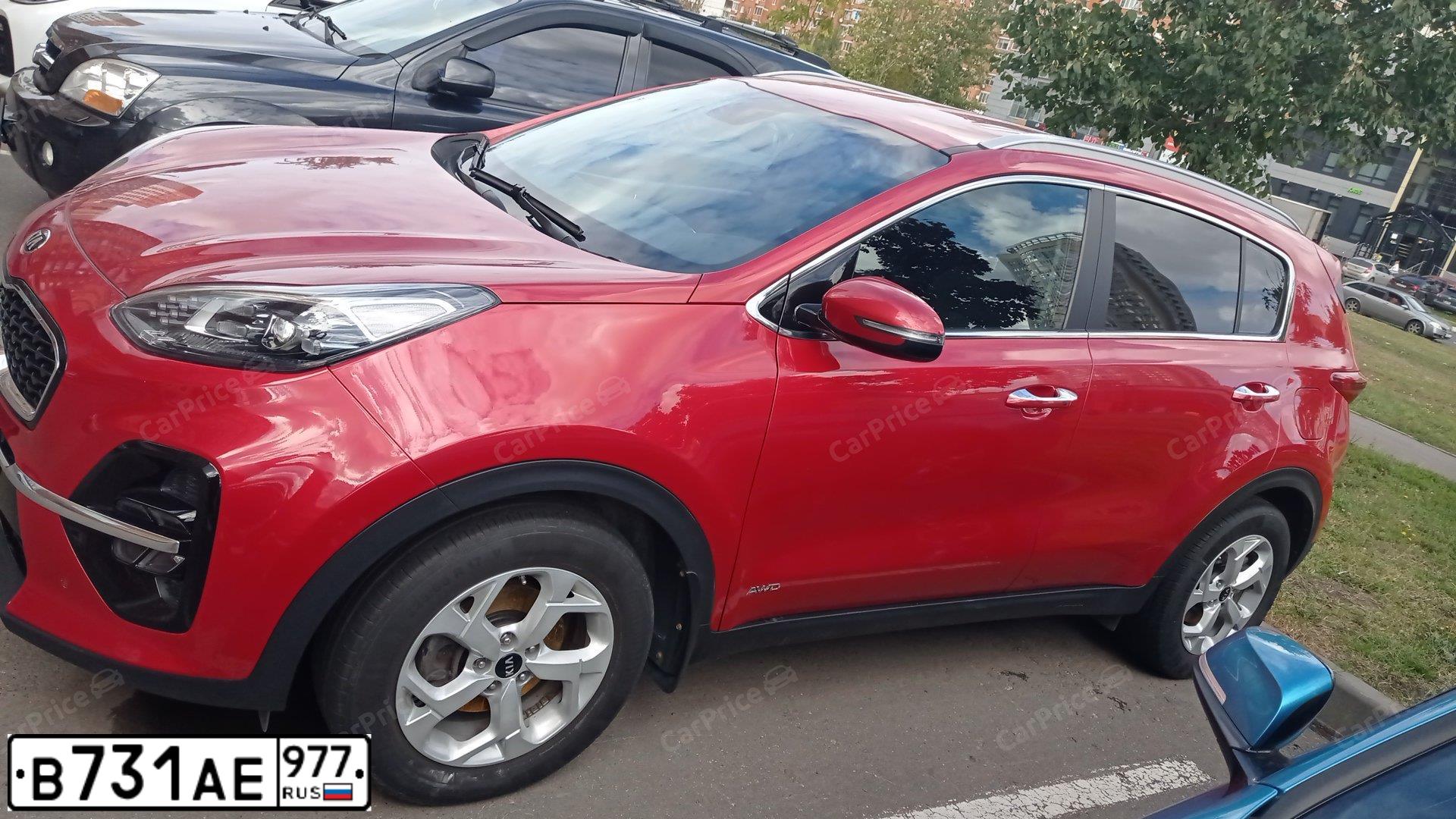 Фото автомобиля KIA SPORTAGE, 2019 — госномер В731АЕ977. Цвет: Красный