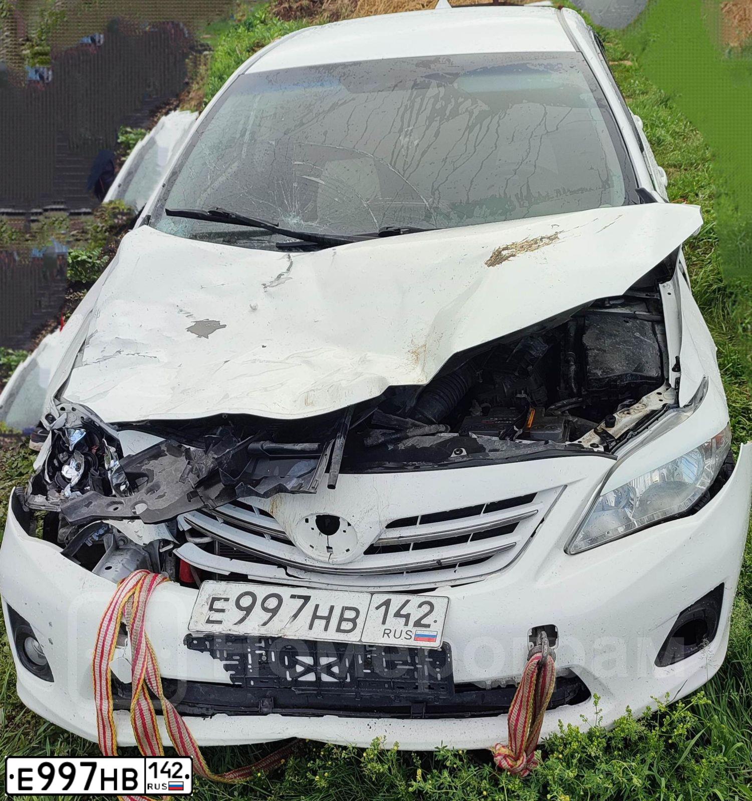 Фото автомобиля TOYOTA COROLLA, 2011 — госномер Н200ХТ42. Цвет: Белый