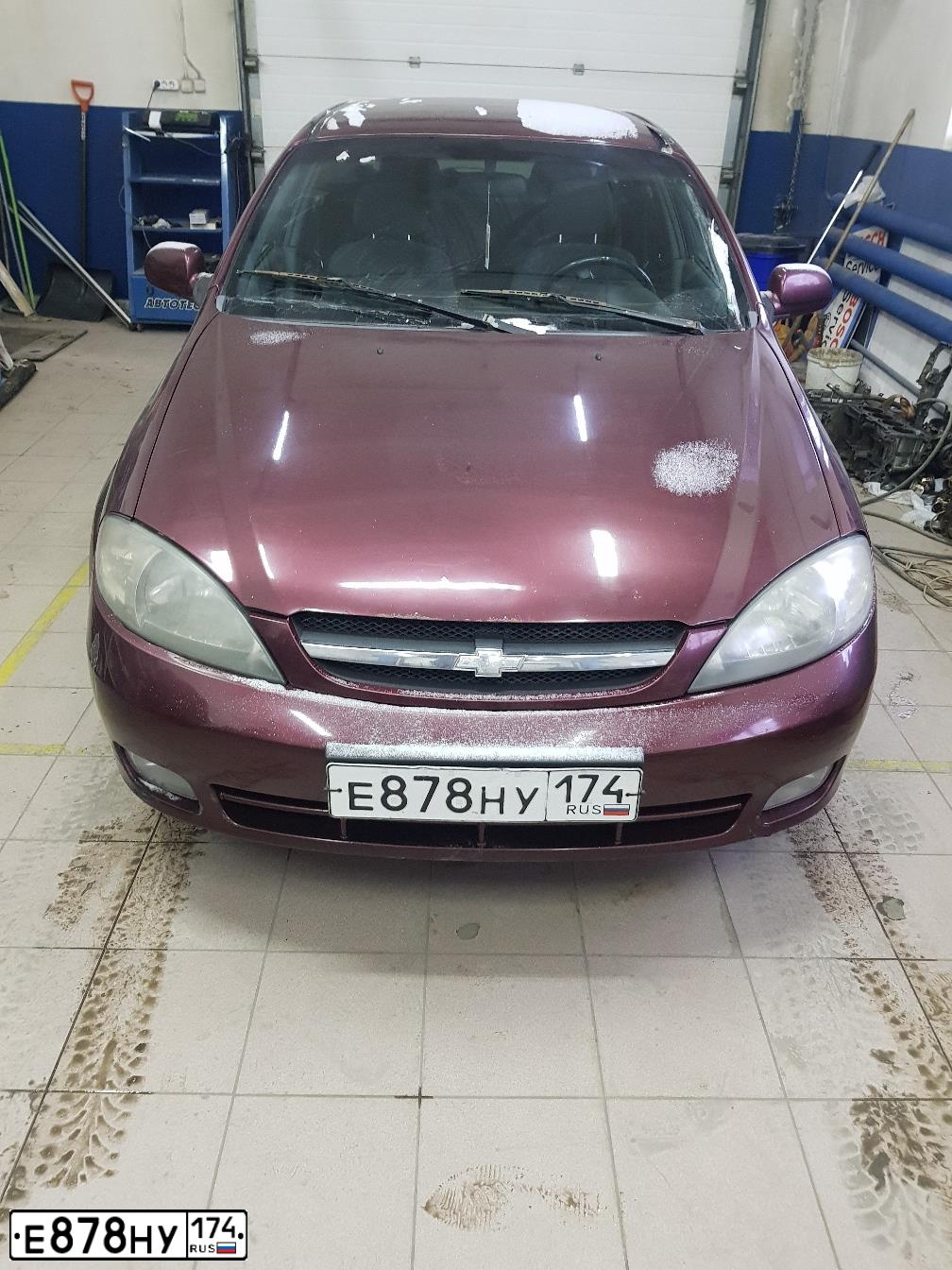 Фото автомобиля CHEVROLET LACETTI, 2007 — госномер Е878НУ174. Цвет: ТЕМНО-КРАСНЫЙ