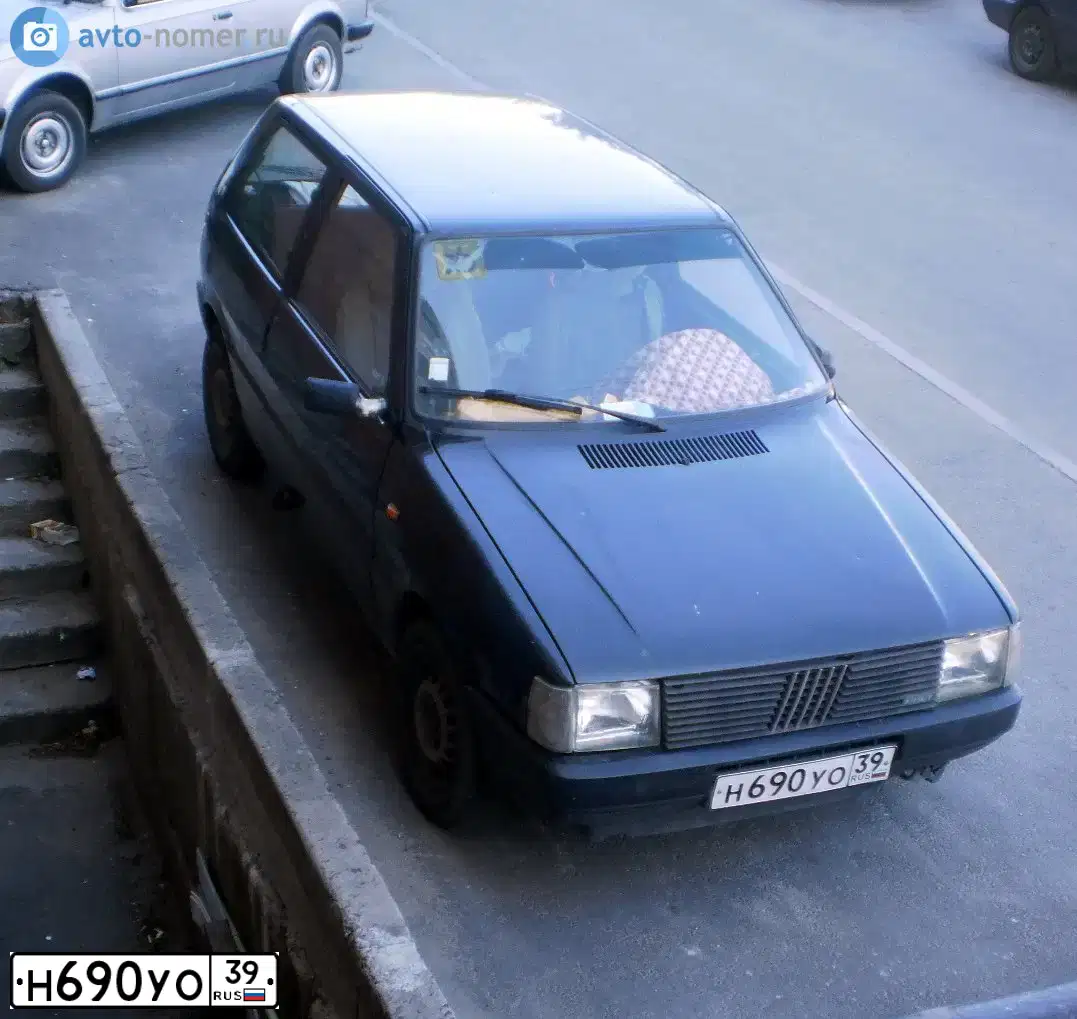 Фото автомобиля FIAT UNO, 1988 — госномер Н690УО39. Цвет: ЧЕРНЫЙ