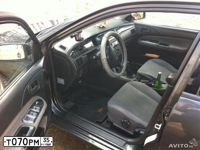 Фото автомобиля MITSUBISHI LANCER, 2004 — госномер М604ВУ35. Цвет: СЕРЫЙ