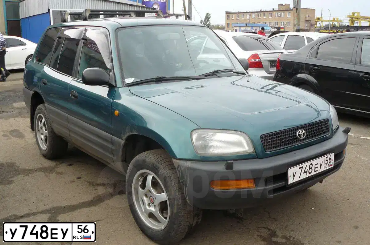 Фото автомобиля TOYOTA RAV4, 1997 — госномер Р248МЕ77. Цвет: ЗЕЛЕНЫЙ