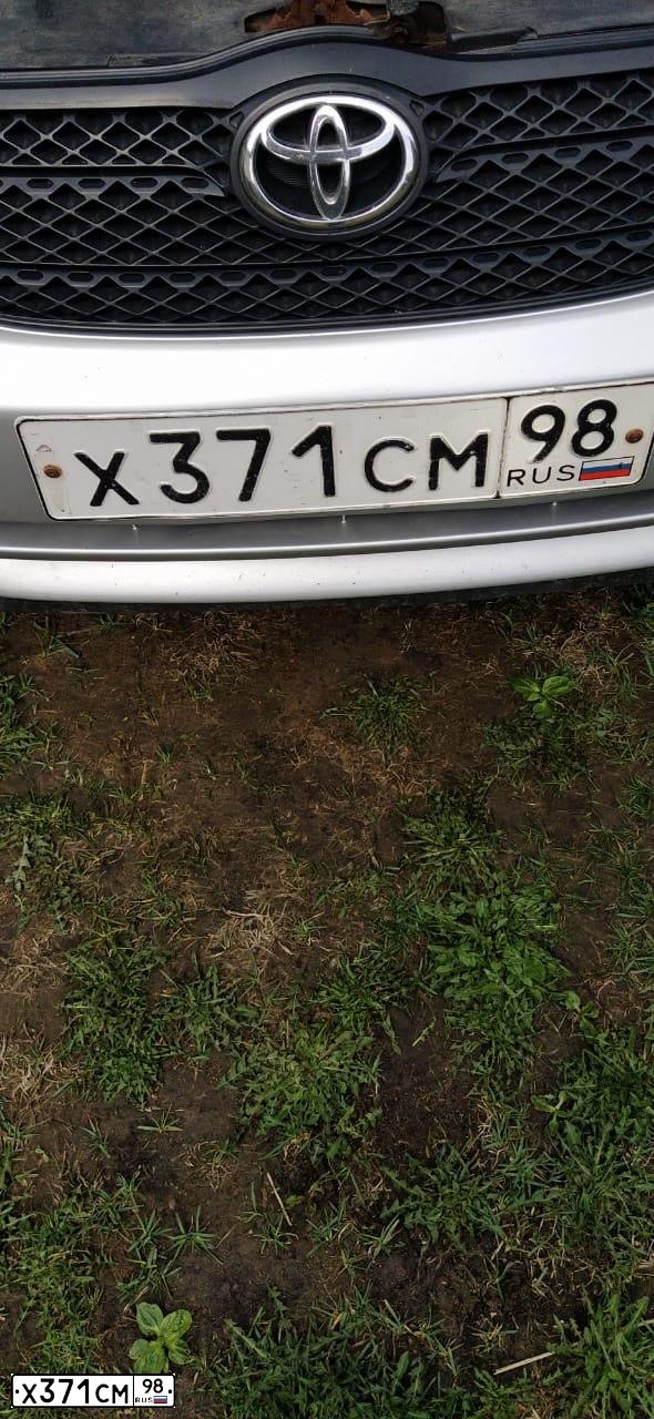 Фото автомобиля TOYOTA COROLLA, 2003 — госномер Х371СМ98. Цвет: Серебристый
