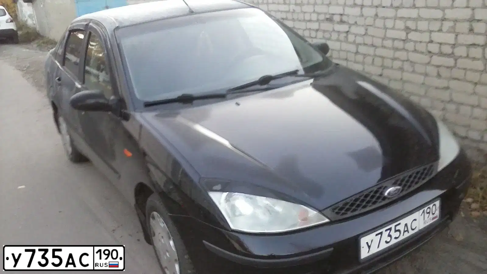 Фото автомобиля FORD FOCUS, 2004 — госномер У196КР136. Цвет: ЧЕРНЫЙ