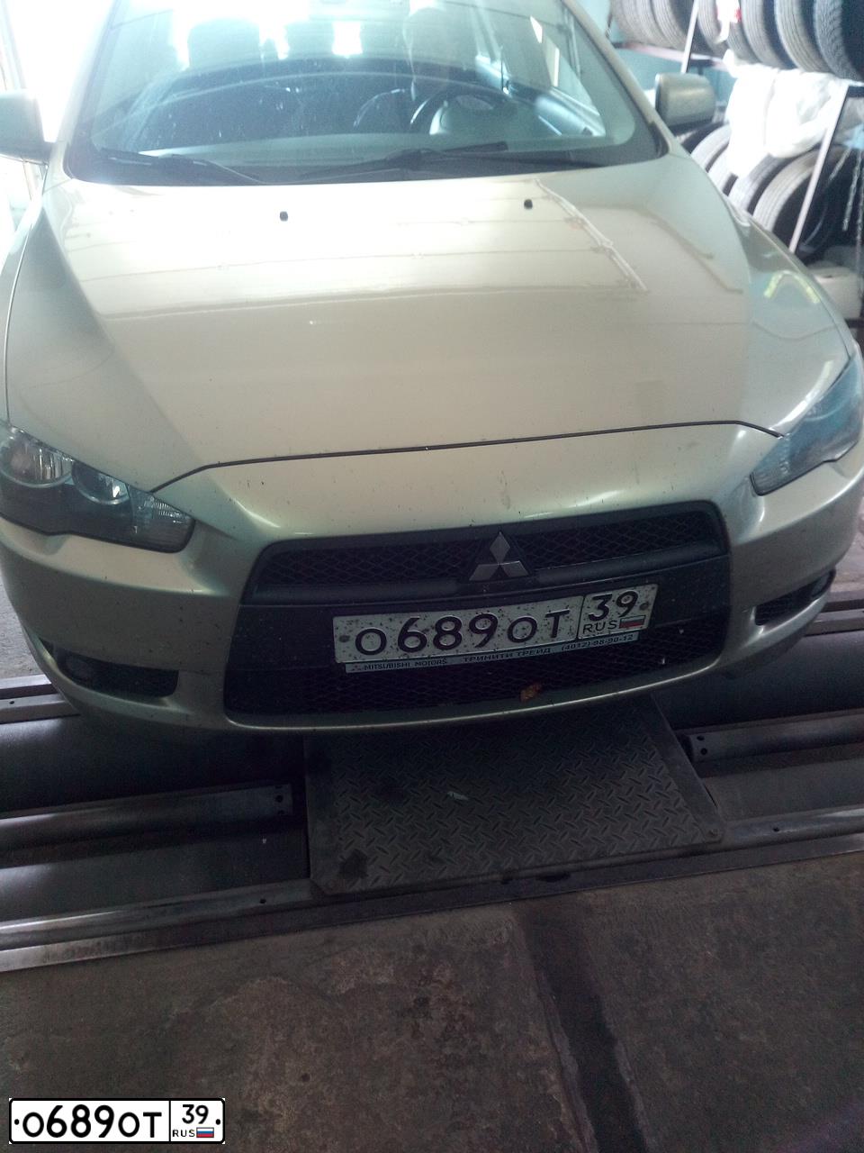 Фото автомобиля MITSUBISHI LANCER, 2008 — госномер О689ОТ39. Цвет: БЕЖЕВЫЙ