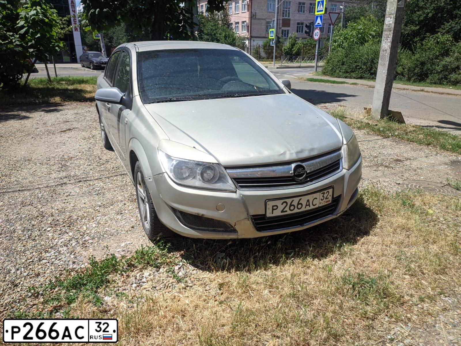 Фото автомобиля OPEL ASTRA, 2008 — госномер Р266АС32. Цвет: БЕЖЕВО-СЕРЫЙ