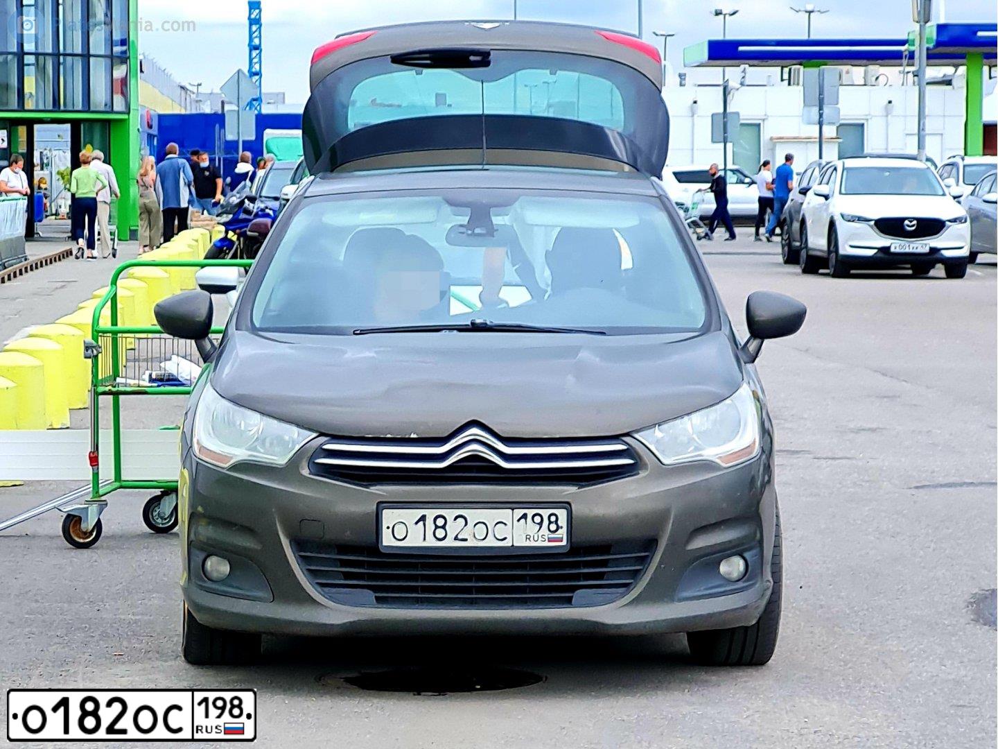 Фото автомобиля CITROEN C4, 2011 — госномер О182ОС198. Цвет: Коричневый
