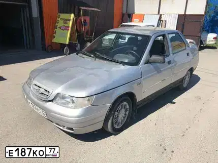 Фото автомобиля LADA 2104, 1995 — госномер Е187КО77. Цвет: БЕЛЫЙ